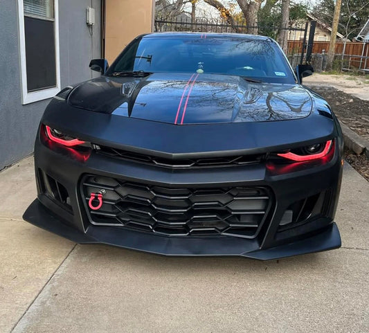 Hero image of a 2014–2015 Chevy Camaro upgraded with a 1LE style front bumper, showcasing an aggressive matte black design with red accents