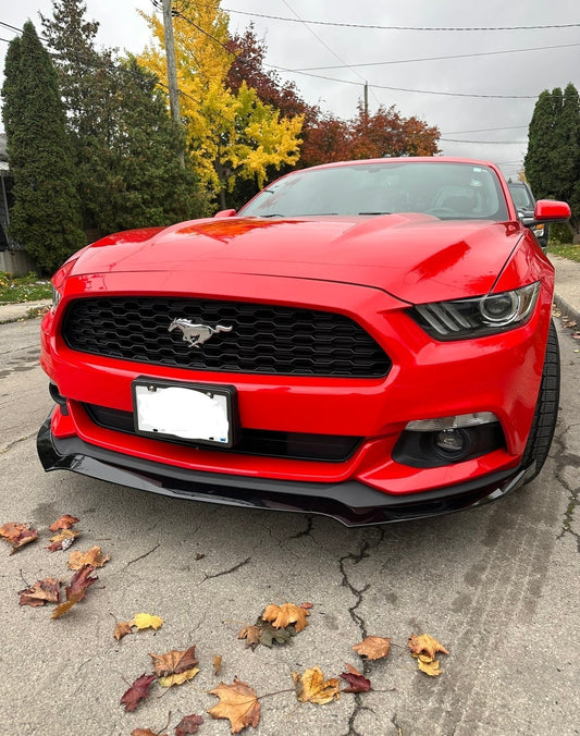 Glossy black front lip on red Ford Mustang 2015–2019 enhancing front bumper styling and protection