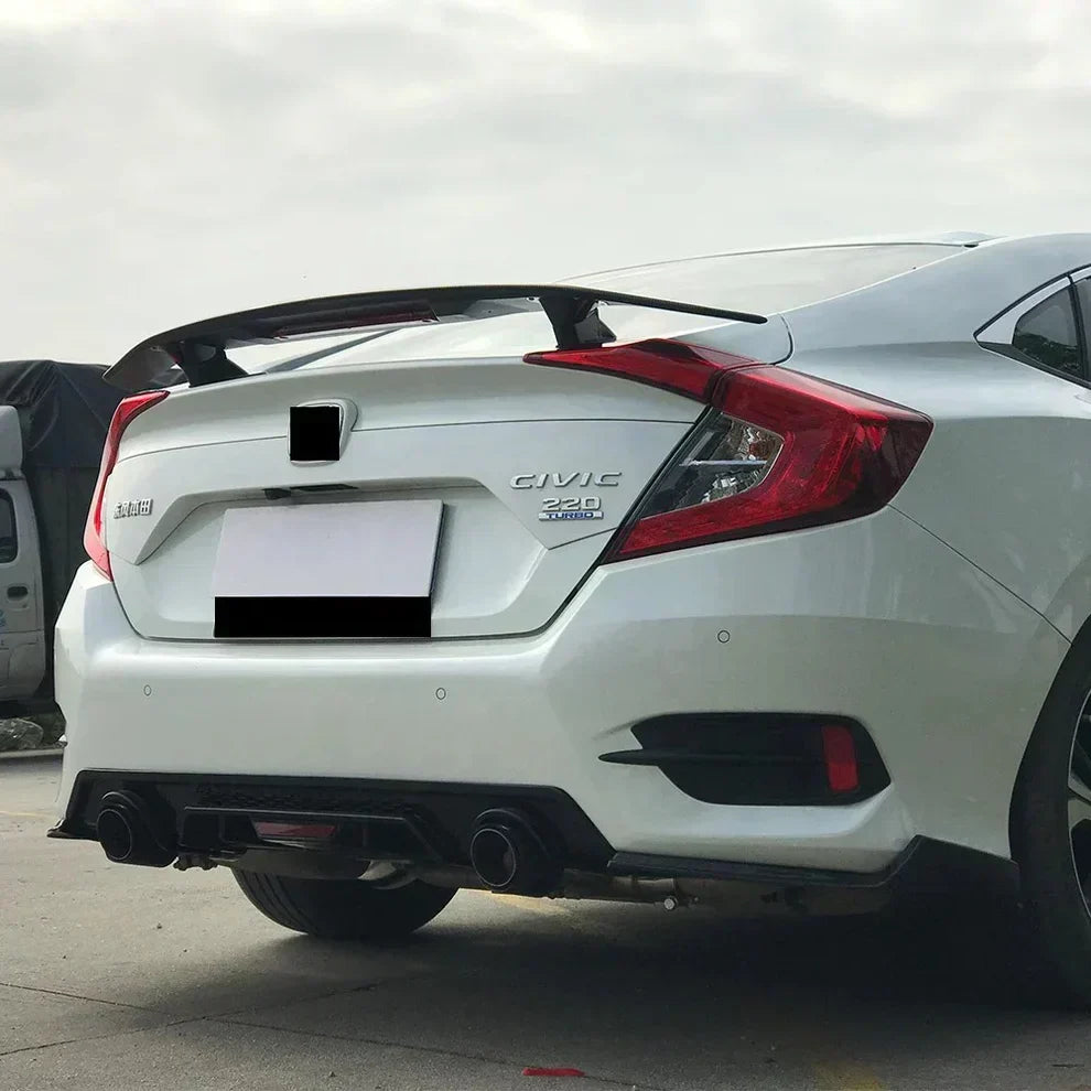 Rear spoiler installed on a white Honda Civic 220 Turbo sedan, showcasing a sporty aerodynamic trunk upgrade for improved style and performance.