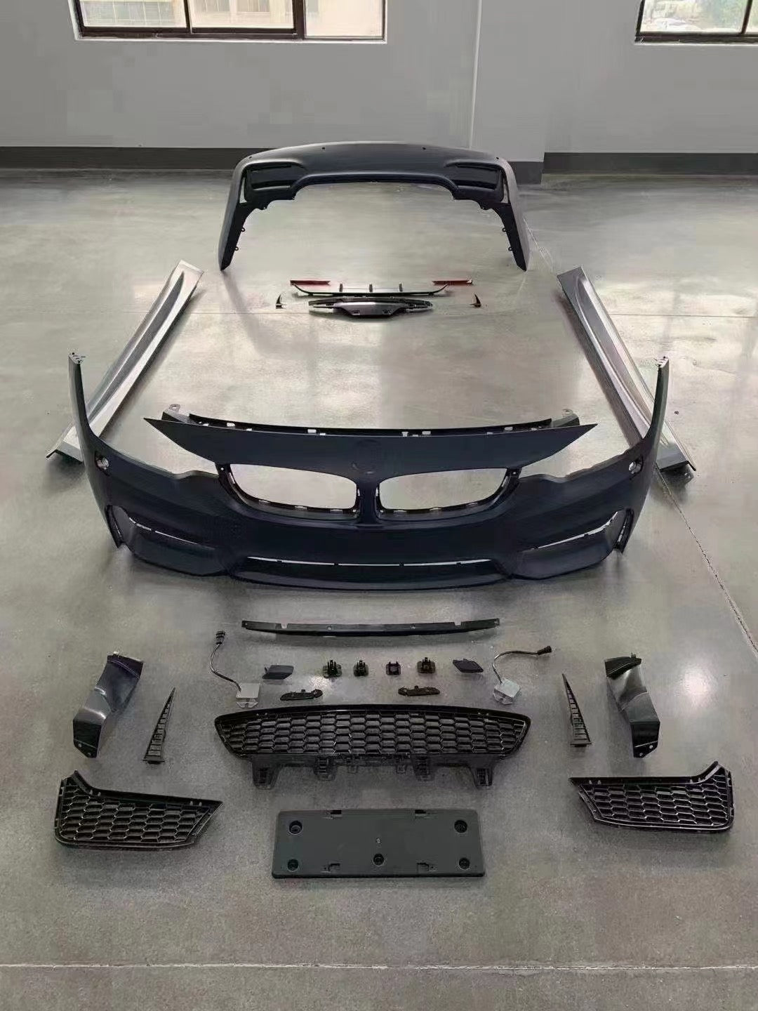 Full BMW M4 conversion kit layout for F32 and F36, including front and rear bumpers, grilles, trim pieces, and mounting hardware.