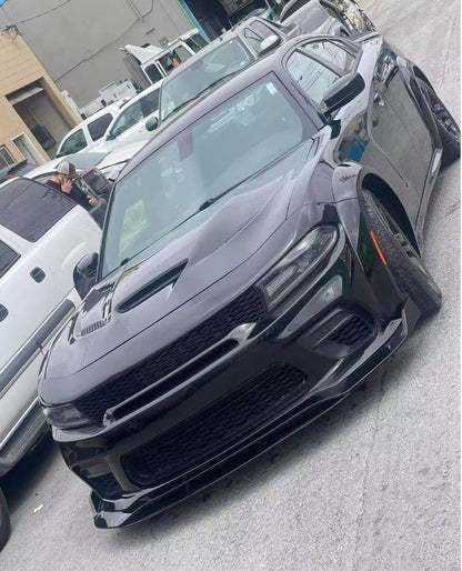 Black Dodge Charger with SRT-style Hellcat wide body kit installed, featuring aggressive front bumper, wider fenders, and aerodynamic styling — available from OneCarWorld.