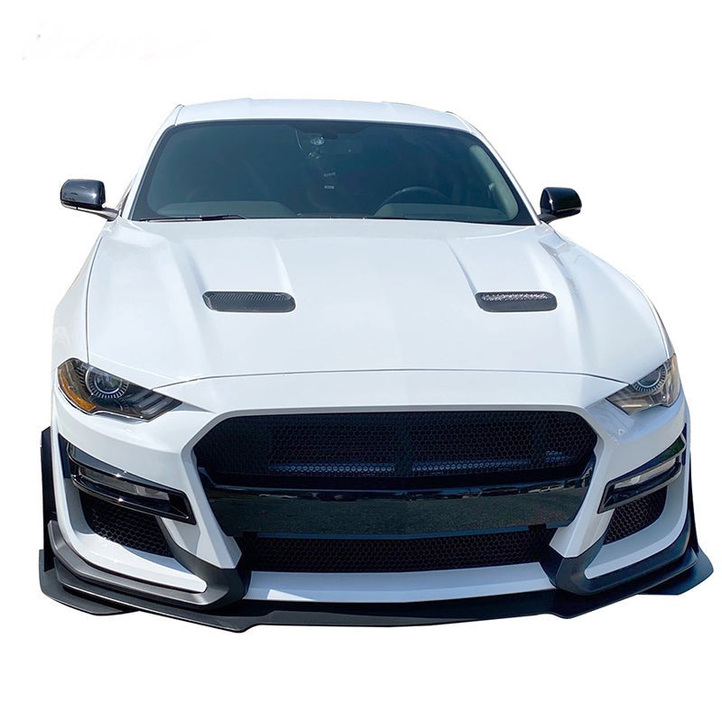 Front view of a white 2018–2022 Ford Mustang featuring a Shelby GT500 front bumper conversion kit, highlighting the clean fitment, aggressive grille design, and aerodynamic styling.